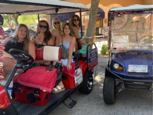 girls in golf cart